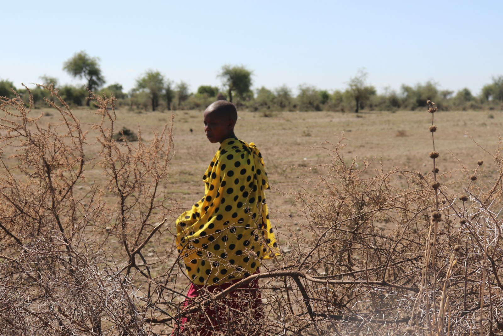 Neema, a young farmer, in her field