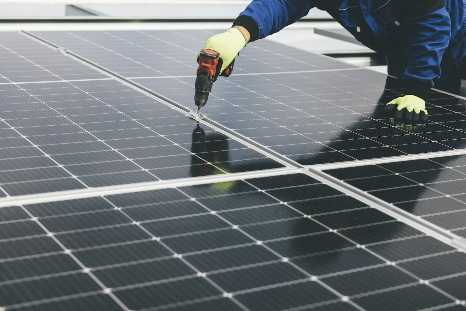 A technician installing solar panels